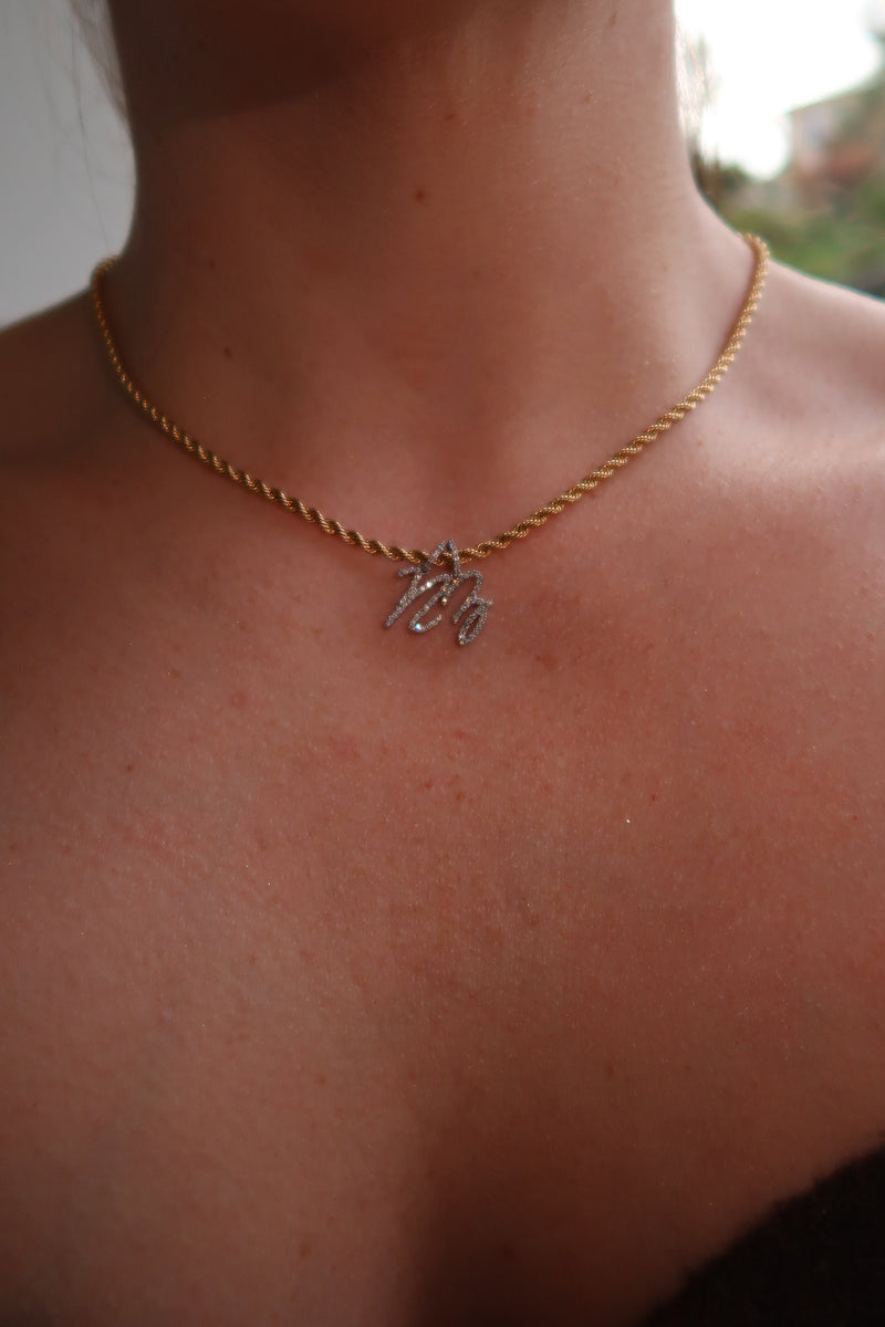 The Cursive Diamond Initial